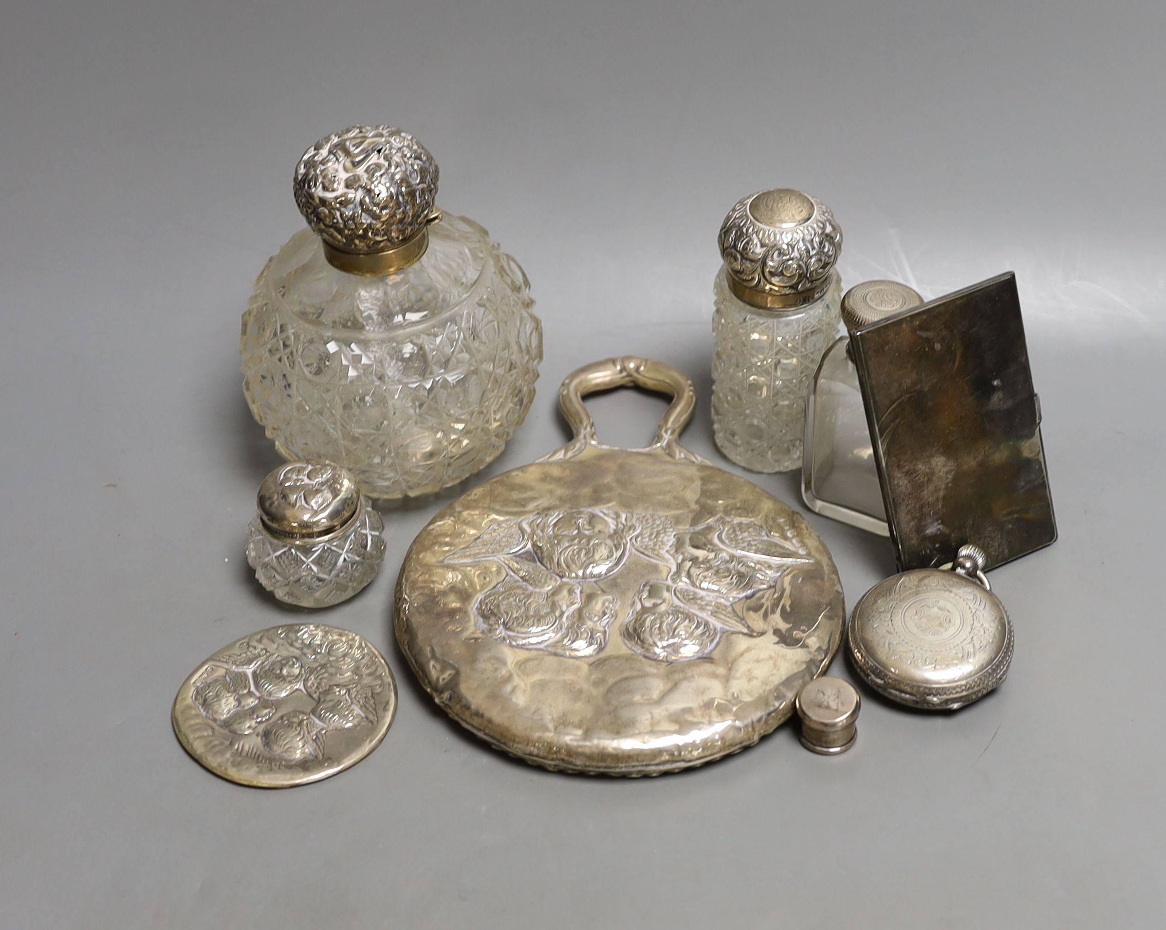 Sundry small silverware, consisting of a hand mirror, four silver topped toilet bottles, a plated card case, pocket watch, etc